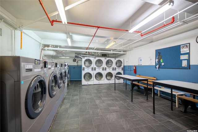 laundry area with separate washer and dryer and stacked washer / dryer