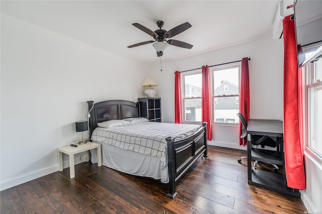 bedroom with ceiling fan and dark wood-type flooring