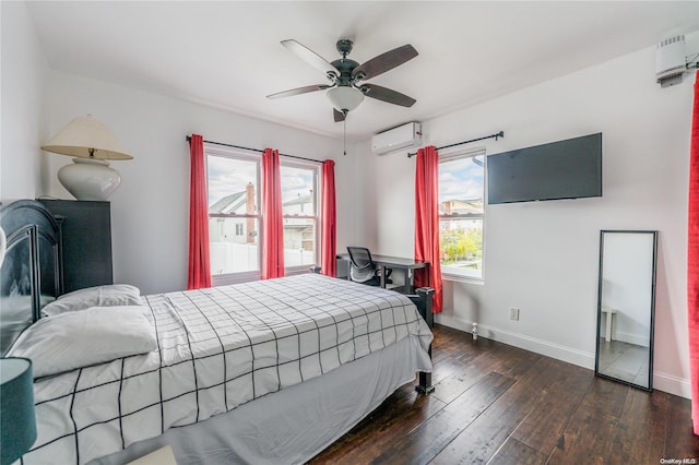 bedroom with dark hardwood / wood-style floors, a wall mounted AC, and ceiling fan