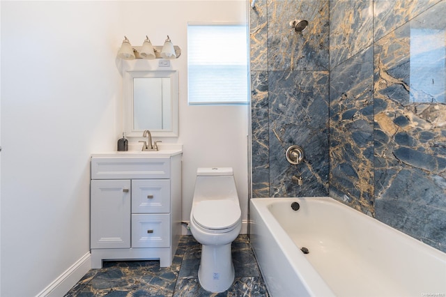 full bathroom featuring tiled shower / bath, vanity, and toilet