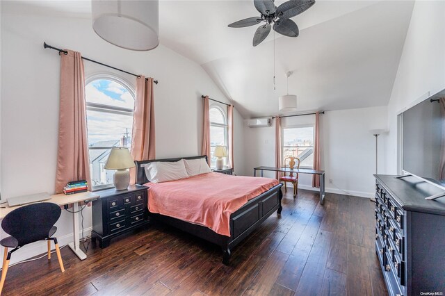 bedroom featuring dark hardwood / wood-style floors, an AC wall unit, ceiling fan, and lofted ceiling