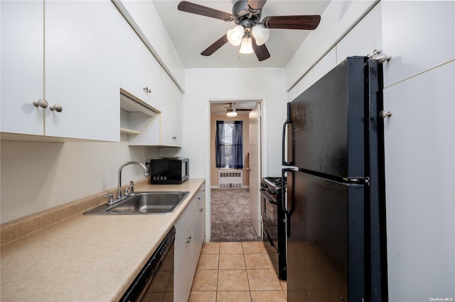 kitchen featuring ceiling fan, sink, light tile patterned floors, white cabinets, and black appliances