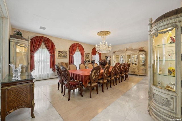 dining space with a chandelier