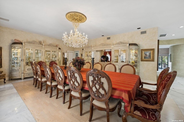 dining space featuring an inviting chandelier