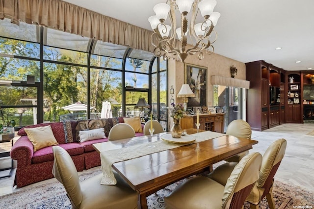 dining room with a notable chandelier and a healthy amount of sunlight