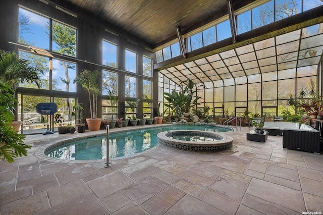 view of swimming pool with an in ground hot tub, a patio, and an outdoor hangout area