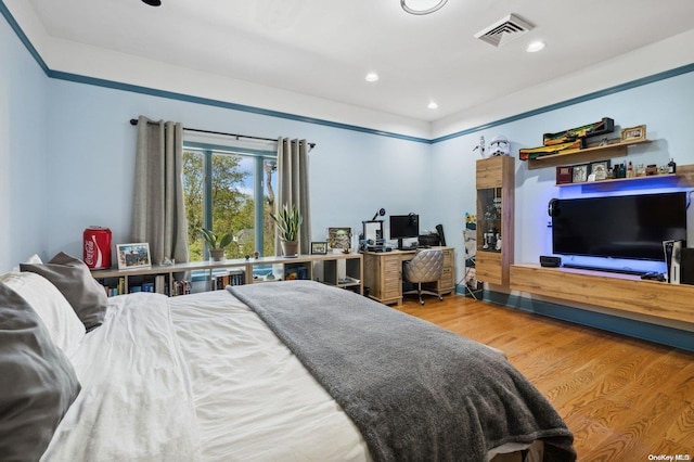 bedroom featuring wood-type flooring