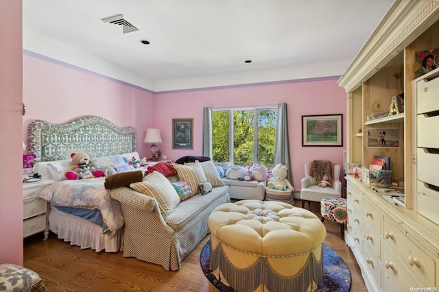 bedroom featuring a baseboard radiator and dark wood-type flooring