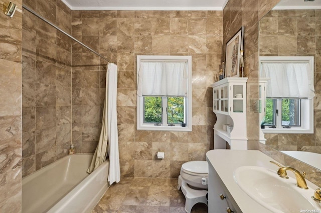 full bathroom featuring shower / bathtub combination with curtain, toilet, vanity, tile walls, and ornamental molding