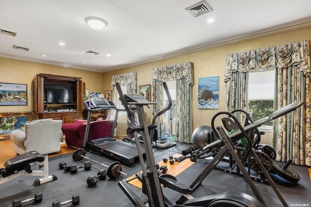 workout room with crown molding