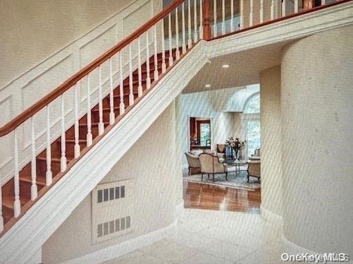 staircase featuring tile patterned floors