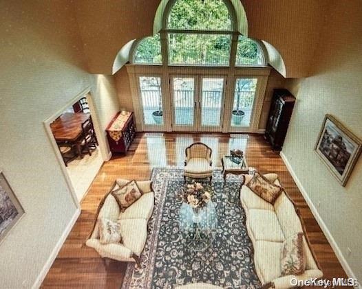 living room with hardwood / wood-style floors and french doors