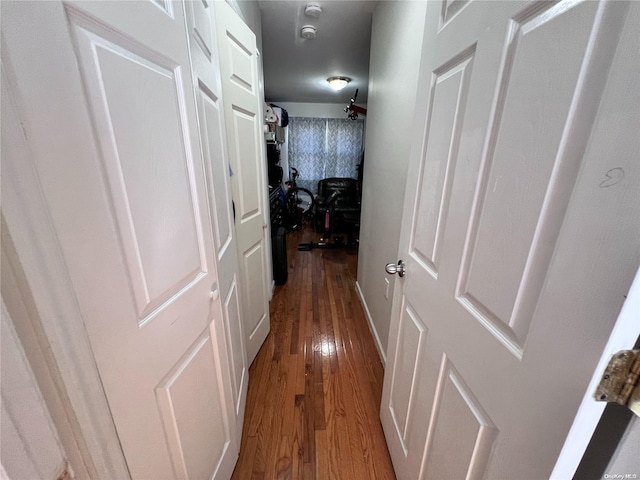 corridor featuring hardwood / wood-style floors