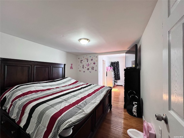 bedroom featuring hardwood / wood-style floors