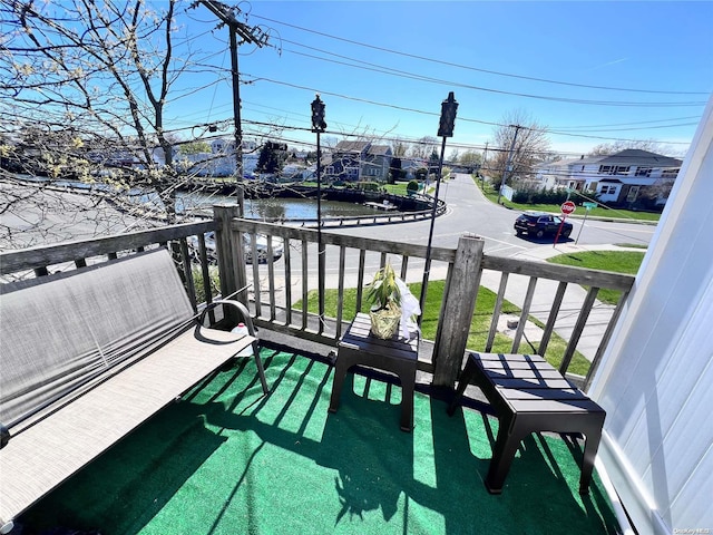 balcony featuring a water view