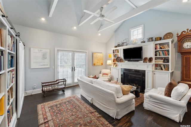 living room with dark hardwood / wood-style flooring, plenty of natural light, and ceiling fan