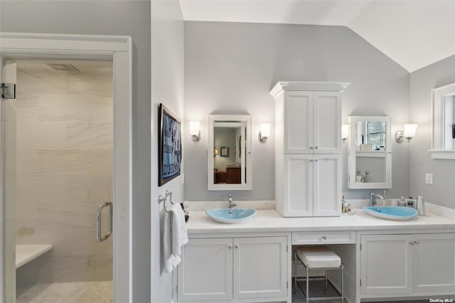 bathroom with vanity, an enclosed shower, and lofted ceiling