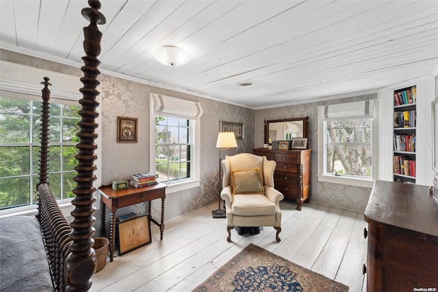 sitting room featuring light hardwood / wood-style floors, built in features, and wood ceiling