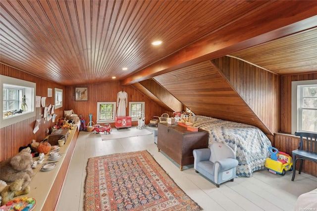 bedroom featuring lofted ceiling, wood walls, and wood ceiling