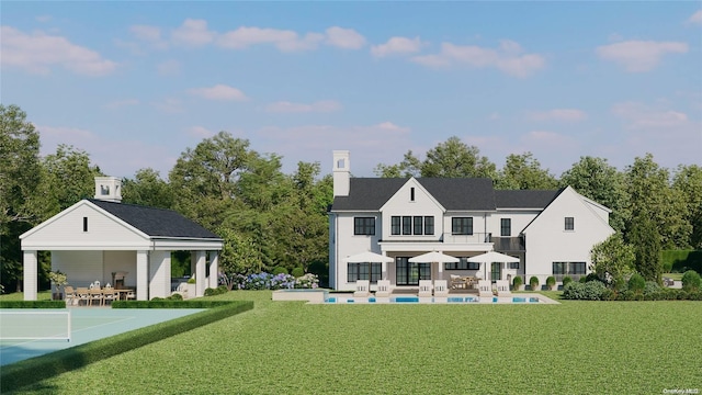 rear view of house featuring a patio, a lawn, and basketball hoop