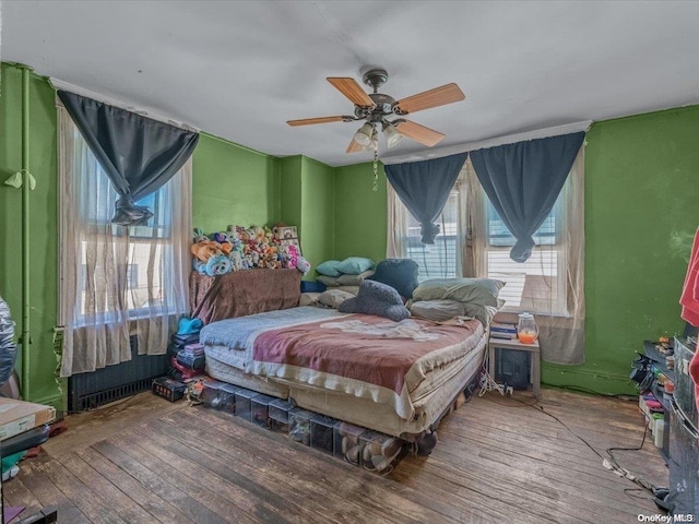 bedroom featuring ceiling fan and wood-type flooring