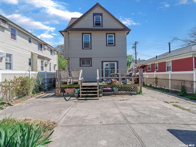 rear view of house with a deck