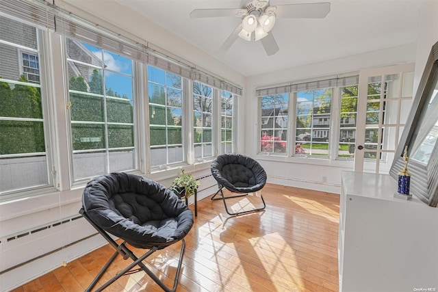 sunroom / solarium with a wealth of natural light and ceiling fan