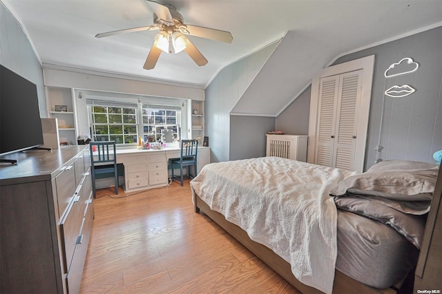 bedroom with ceiling fan, baseboard heating, lofted ceiling, a closet, and light wood-type flooring