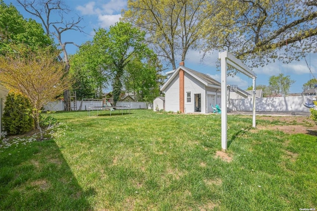 view of yard featuring a trampoline