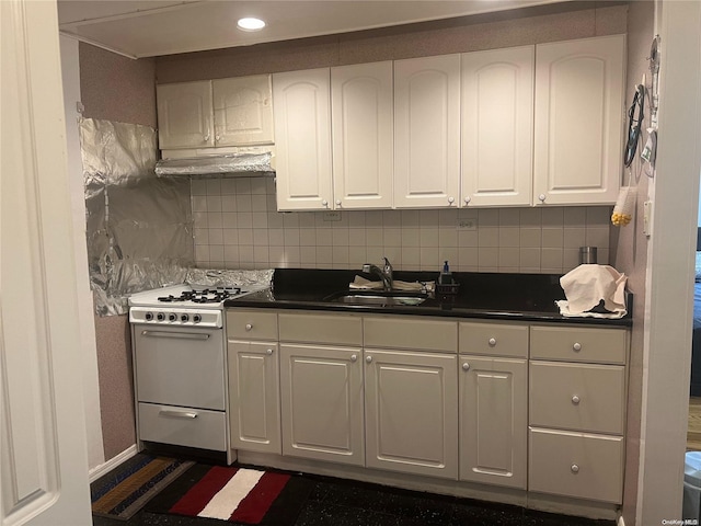 kitchen with white cabinets, gas range gas stove, and sink