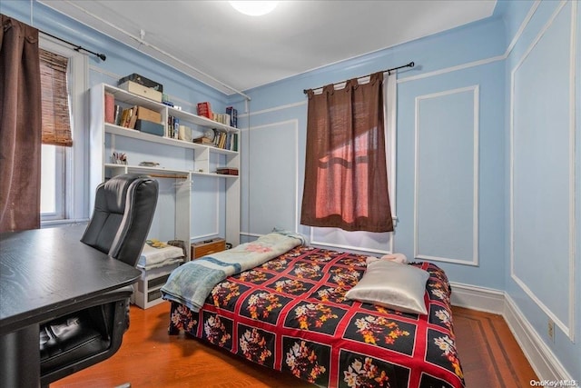 bedroom featuring hardwood / wood-style floors