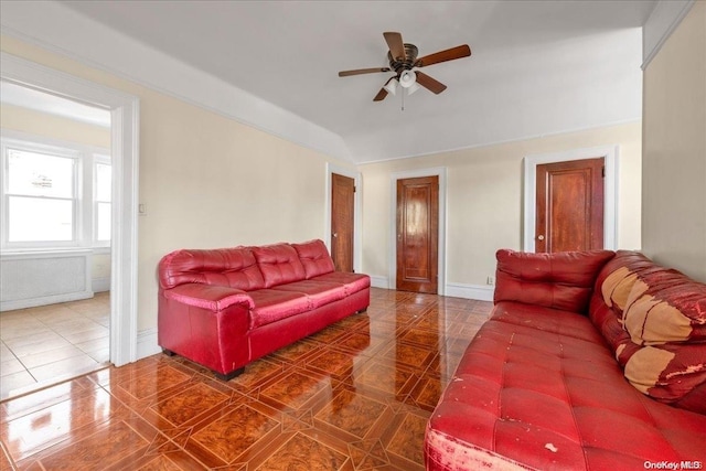 tiled living room with ceiling fan