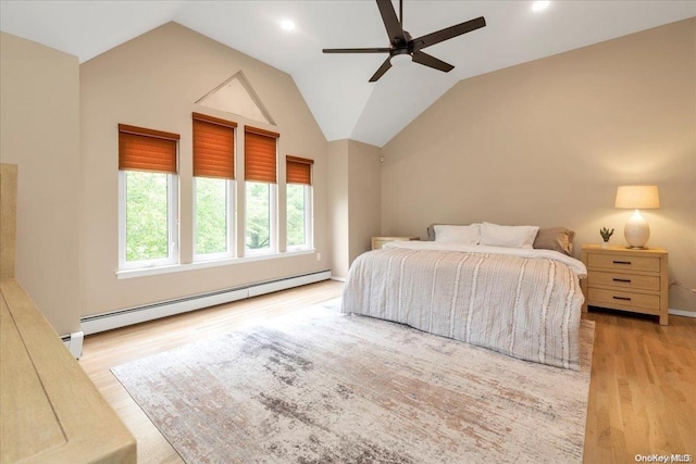 bedroom with a baseboard radiator, ceiling fan, lofted ceiling, and light hardwood / wood-style floors