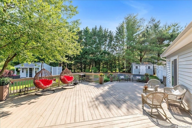 wooden terrace featuring a shed