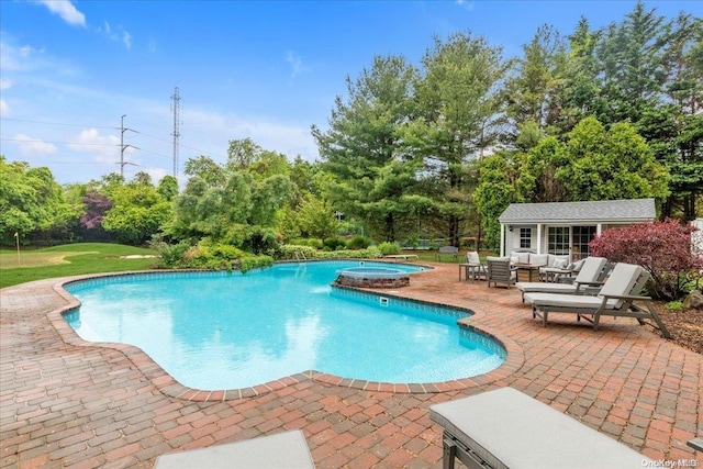 view of swimming pool with an outdoor structure, an in ground hot tub, a patio, and an outdoor hangout area