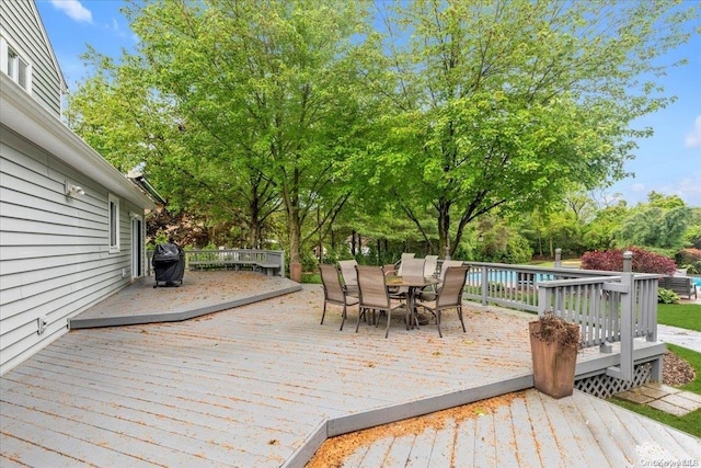 wooden terrace featuring grilling area