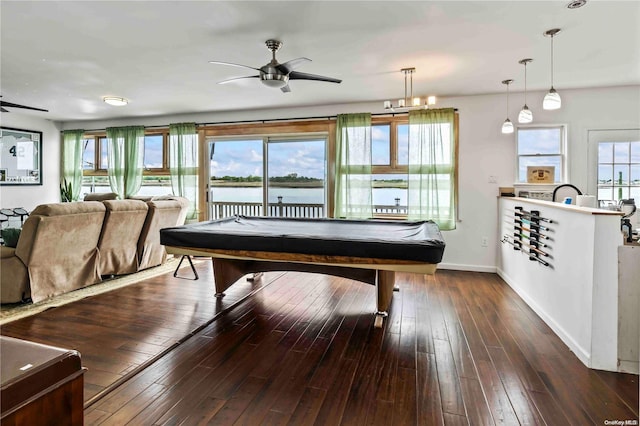 rec room featuring dark hardwood / wood-style floors, a water view, plenty of natural light, and pool table