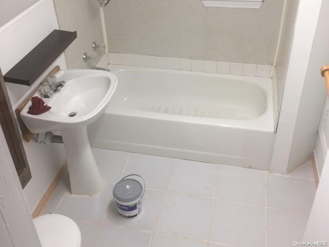 bathroom featuring toilet and tile patterned floors