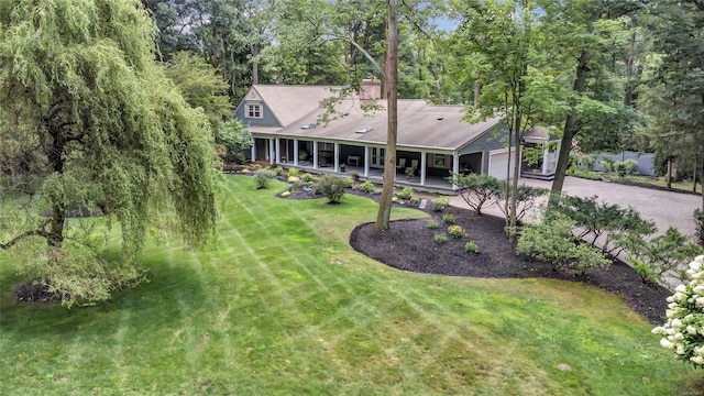 exterior space featuring a front yard and a garage