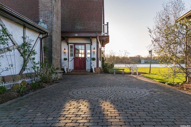 entrance to property with a balcony