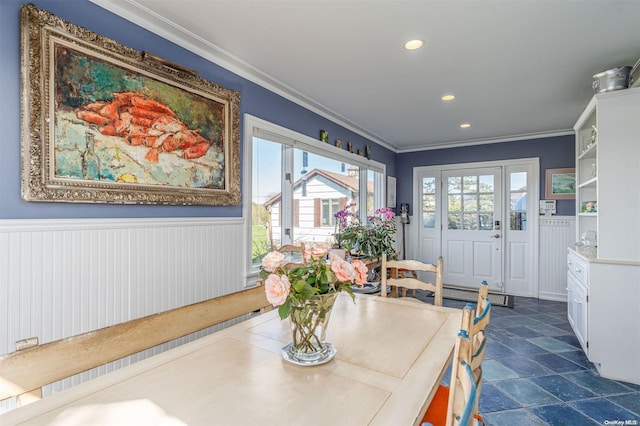 dining space with crown molding