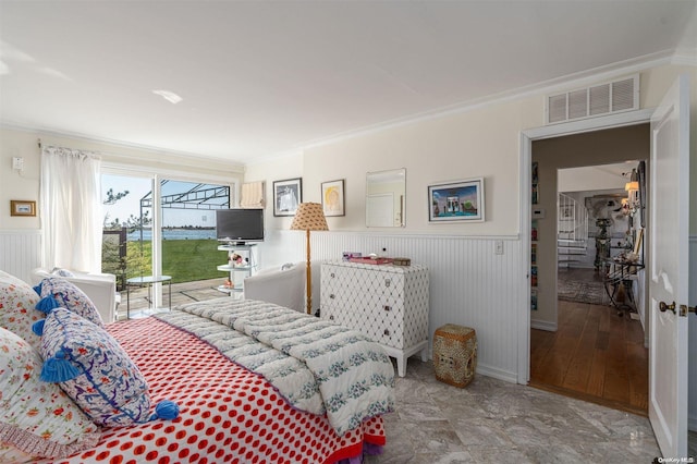 bedroom with hardwood / wood-style floors and crown molding