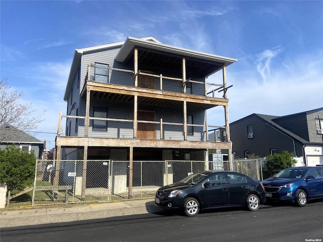 view of front of property with a balcony