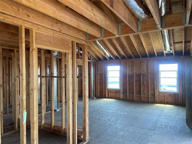 miscellaneous room with vaulted ceiling and a healthy amount of sunlight