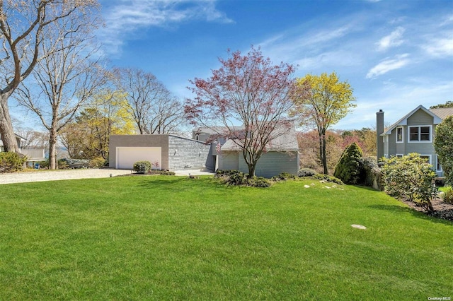 view of yard with a garage