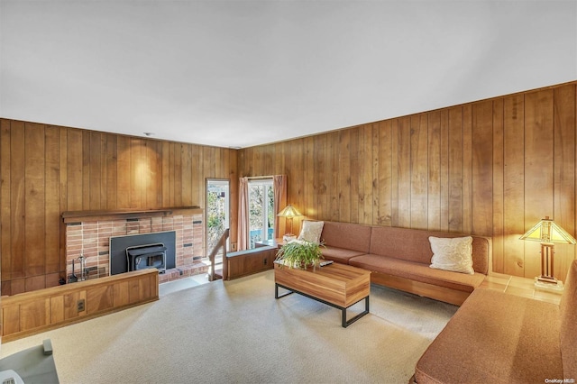 living room featuring a wood stove and wood walls