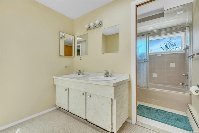 bathroom featuring tile patterned floors, vanity, a baseboard radiator, and combined bath / shower with glass door