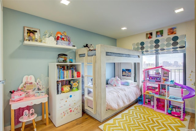 bedroom with hardwood / wood-style flooring