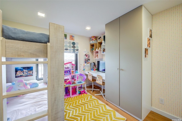 bedroom featuring a closet and light hardwood / wood-style flooring