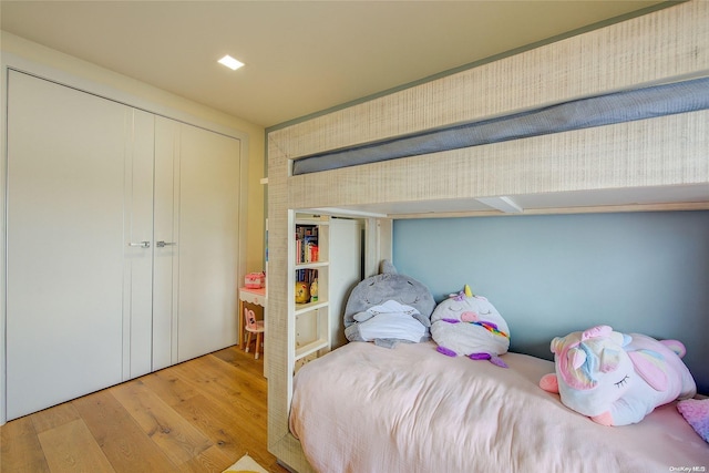 bedroom featuring a closet and light hardwood / wood-style flooring